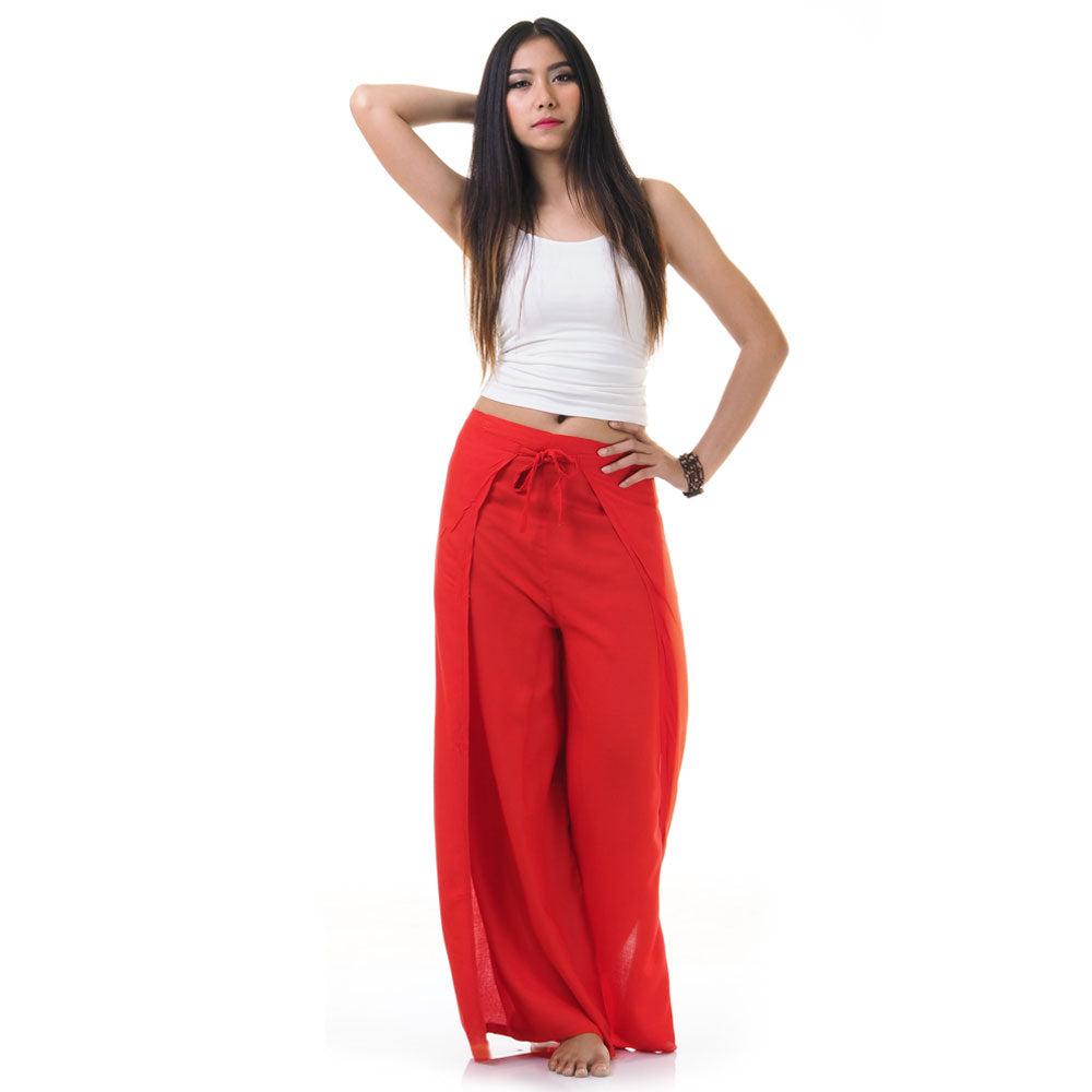 Model wearing red Thai wrap pants skirt with white top, front view
