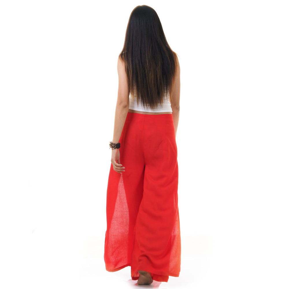 Back view of red Thai wrap pants skirt worn with white top