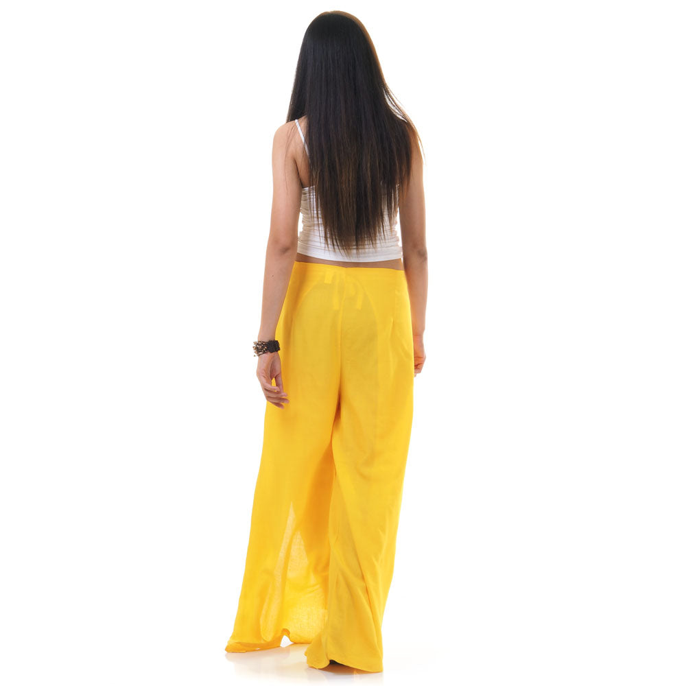 Back view of yellow Thai wrap pants skirt worn with white top