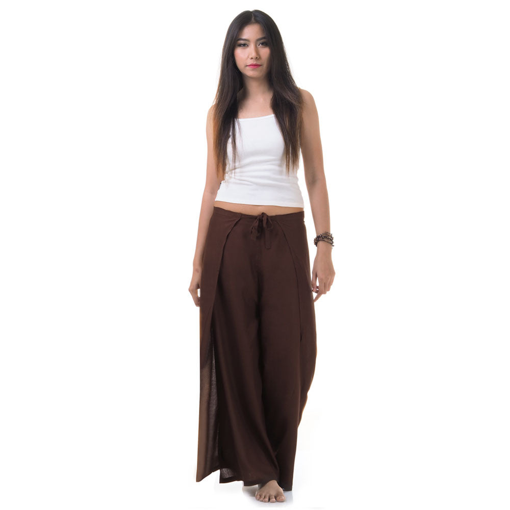 Model wearing brown Thai wrap pants skirt with white top, front view