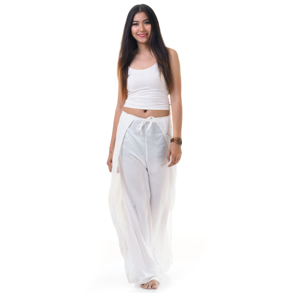Model wearing white Thai wrap pants skirt with white top, front view