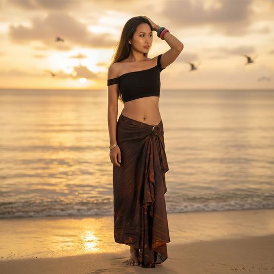 Female model enjoying the sun in the earthy Phi Phi Brown Tie Dye wrap skirt Serenity.