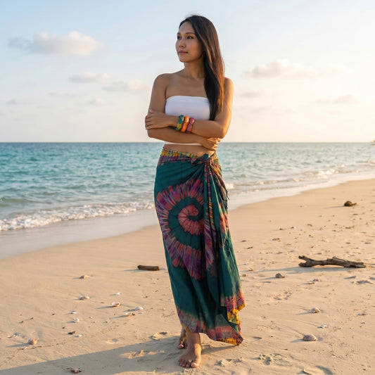 Model walking through the sand in the lush Green Escape Tie Dye wrap skirt Samui.
