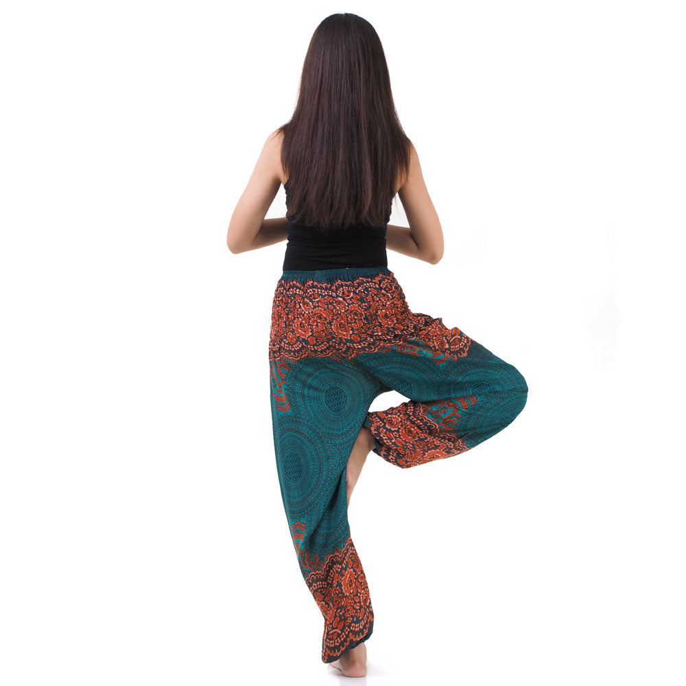 Back view of turquoise Thai harem yoga pants with mandala print worn with black top
