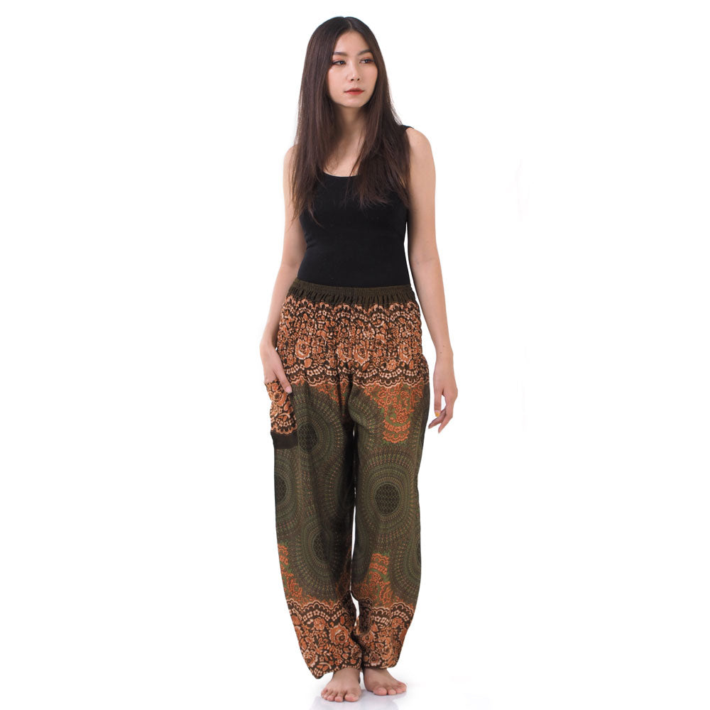 Model wearing olive green Thai harem yoga pants with mandala print and black top, front view