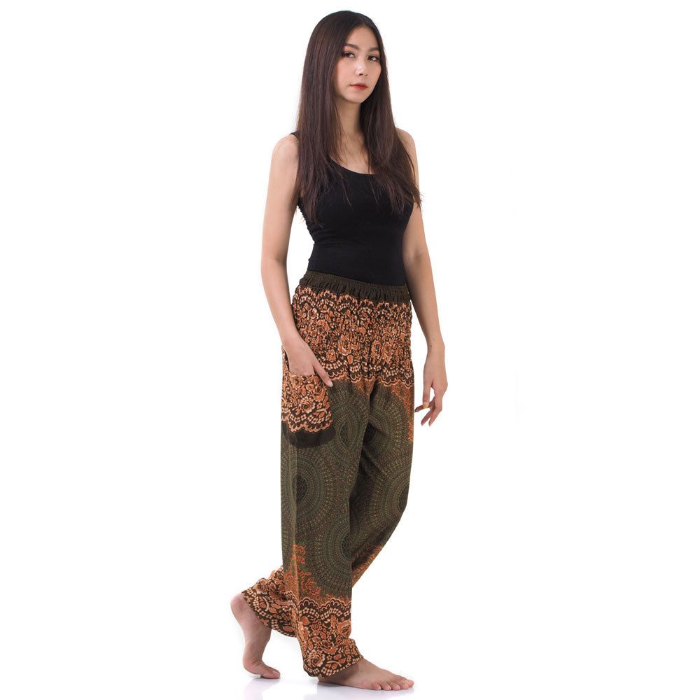 Side view of model in olive green Thai harem yoga pants with mandala print and black top