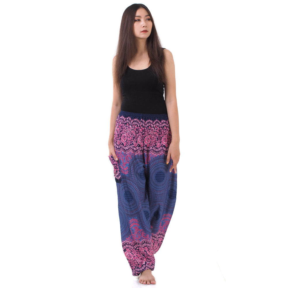 Model wearing purple lavender Thai harem yoga pants with mandala print and black top, front view
