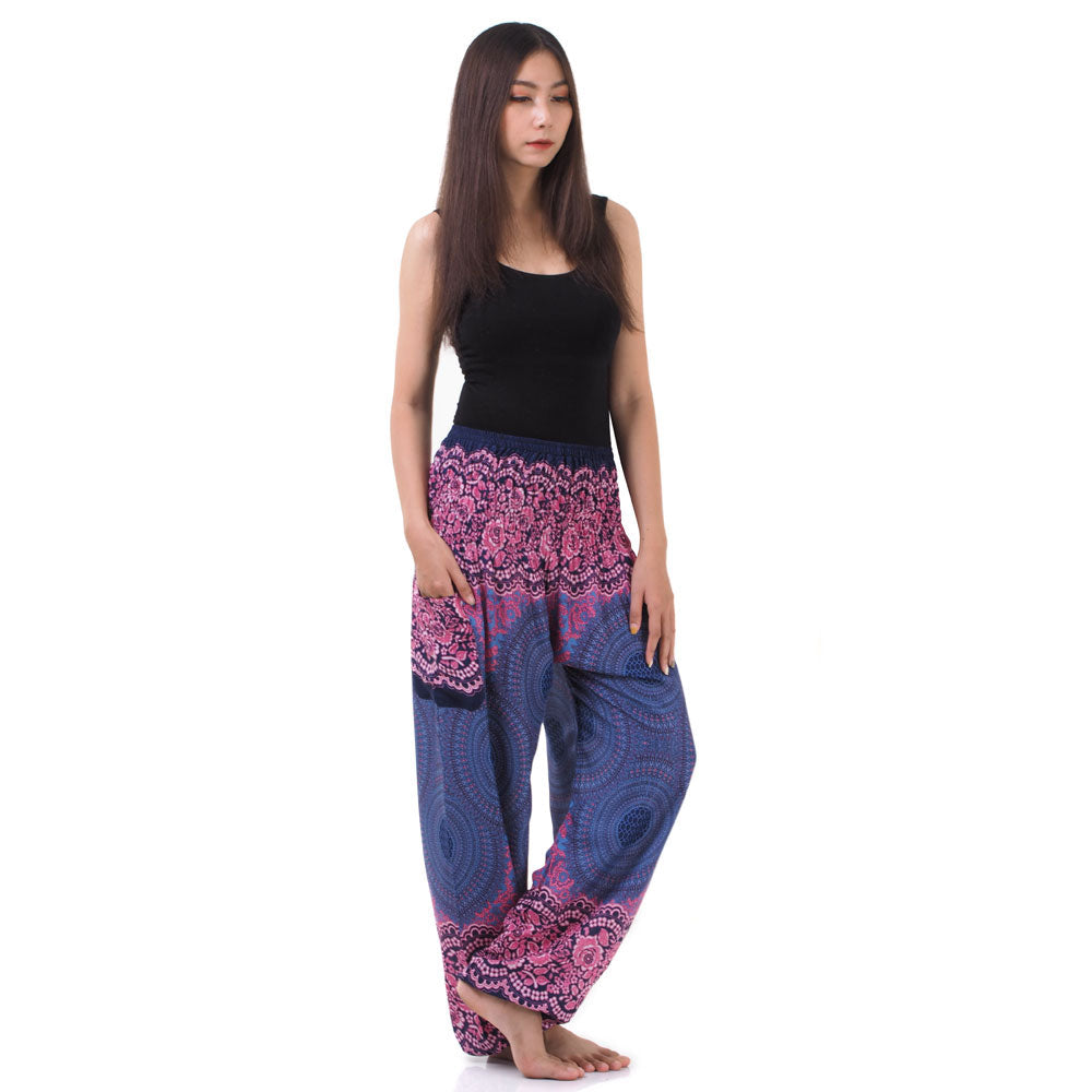 Side view of model in purple lavender Thai harem yoga pants with mandala print and black top