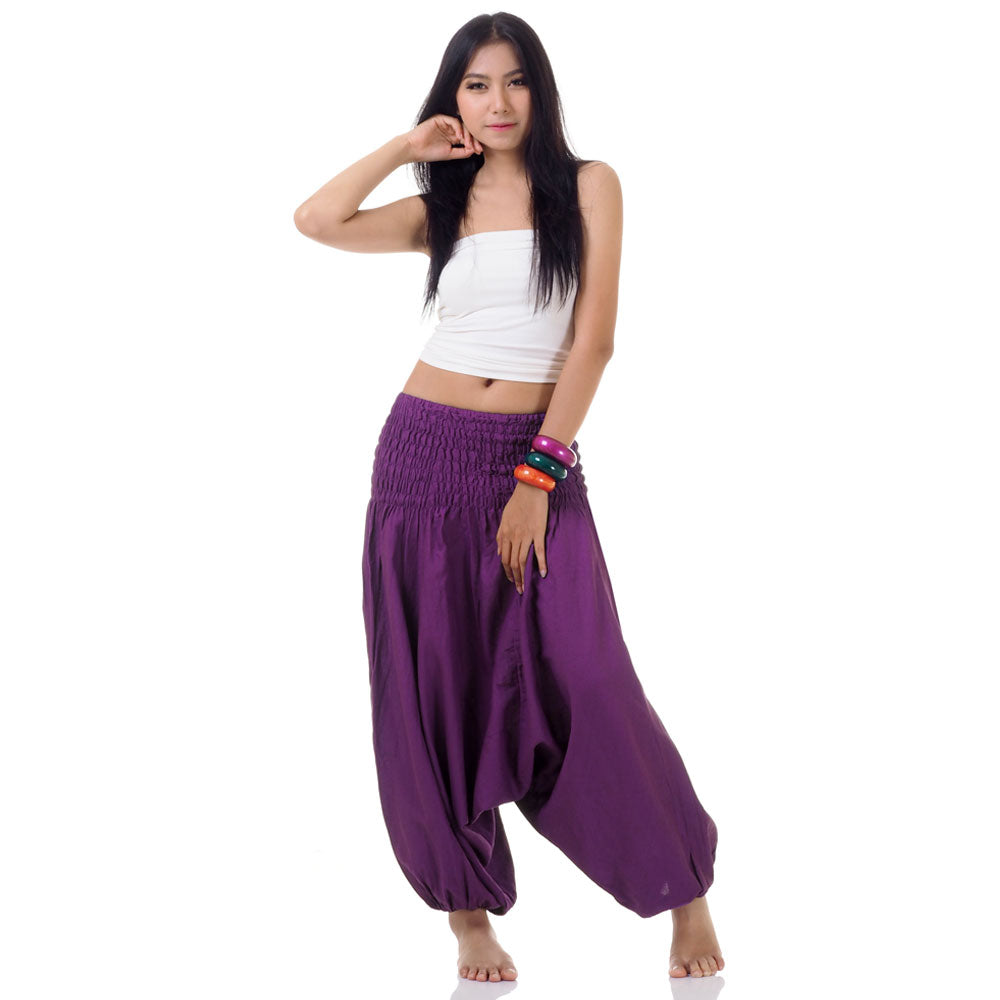 Model wearing purple thai 2-in-1 jumpsuit harem pants with white top, front view