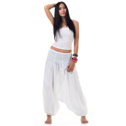 Model wearing white  thai 2-in-1 jumpsuit harem pants with white top, front view