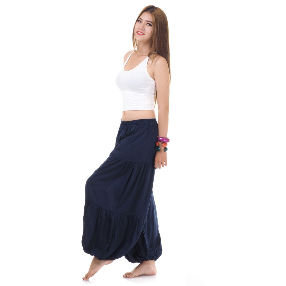 Side view of female model in blue women Thai harem yoga pants with white top
