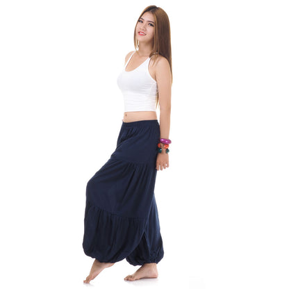 Side view of female model in blue women Thai harem yoga pants with white top