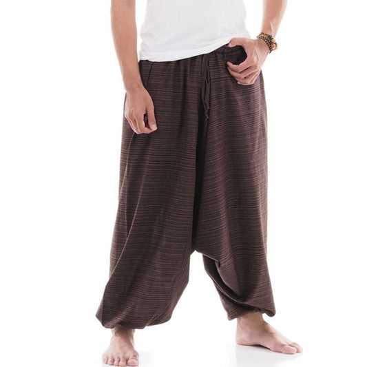 Close-up of a brown men pinstripe drop crotch Thai harem pants