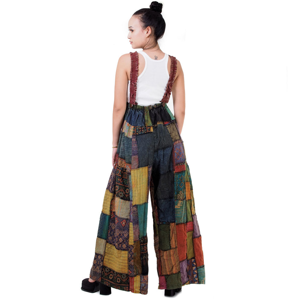Rear view of brown boho wide-leg patchwork jumpsuit overall with elastic straps.