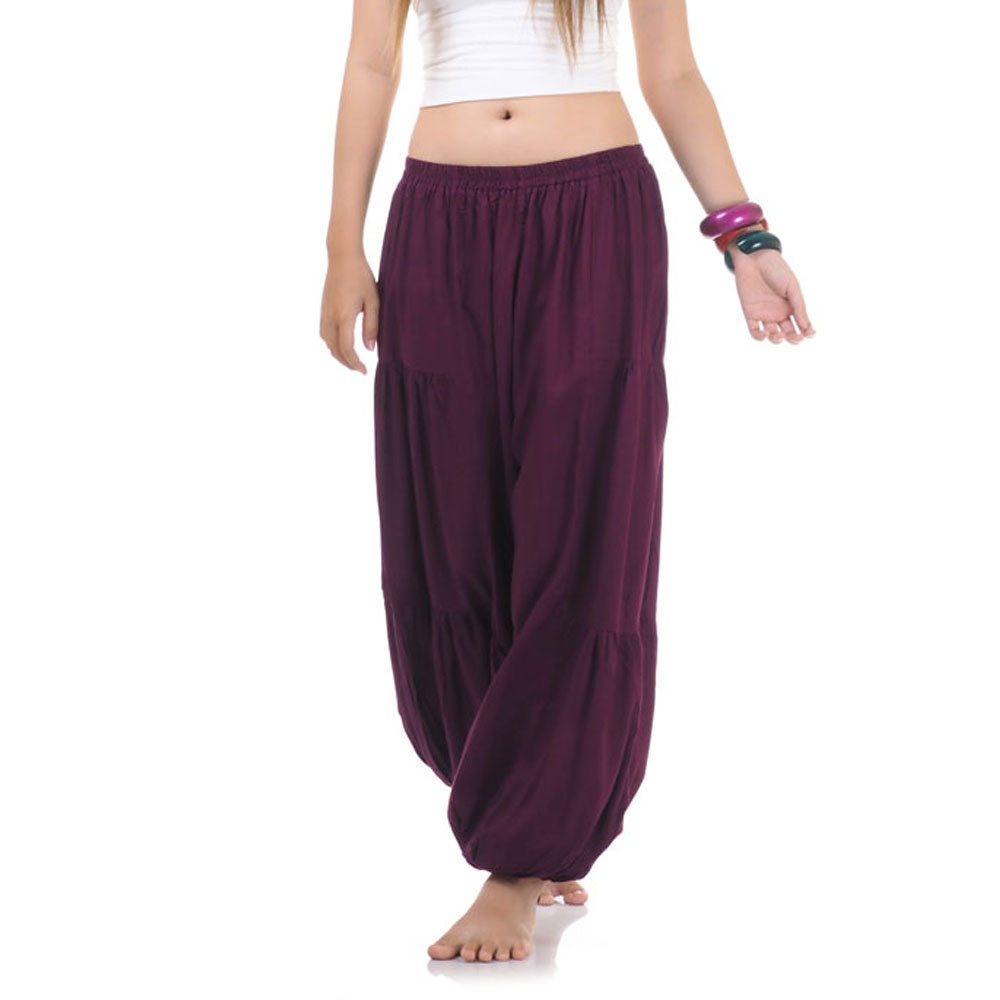 Close-up of a burgundy women Thai harem yoga pants