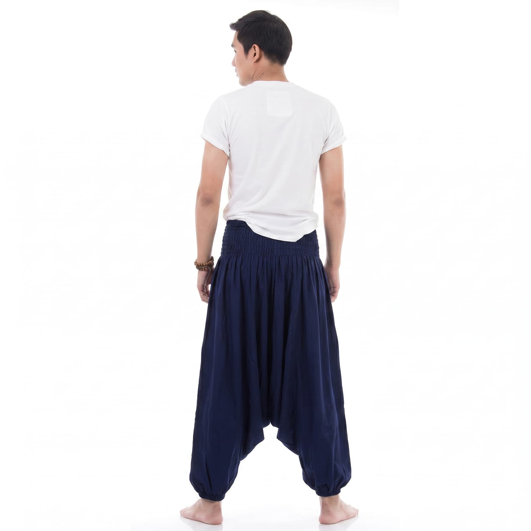 Back view of the dark blue drop crotch harem pants for men, offering maximum breathability.