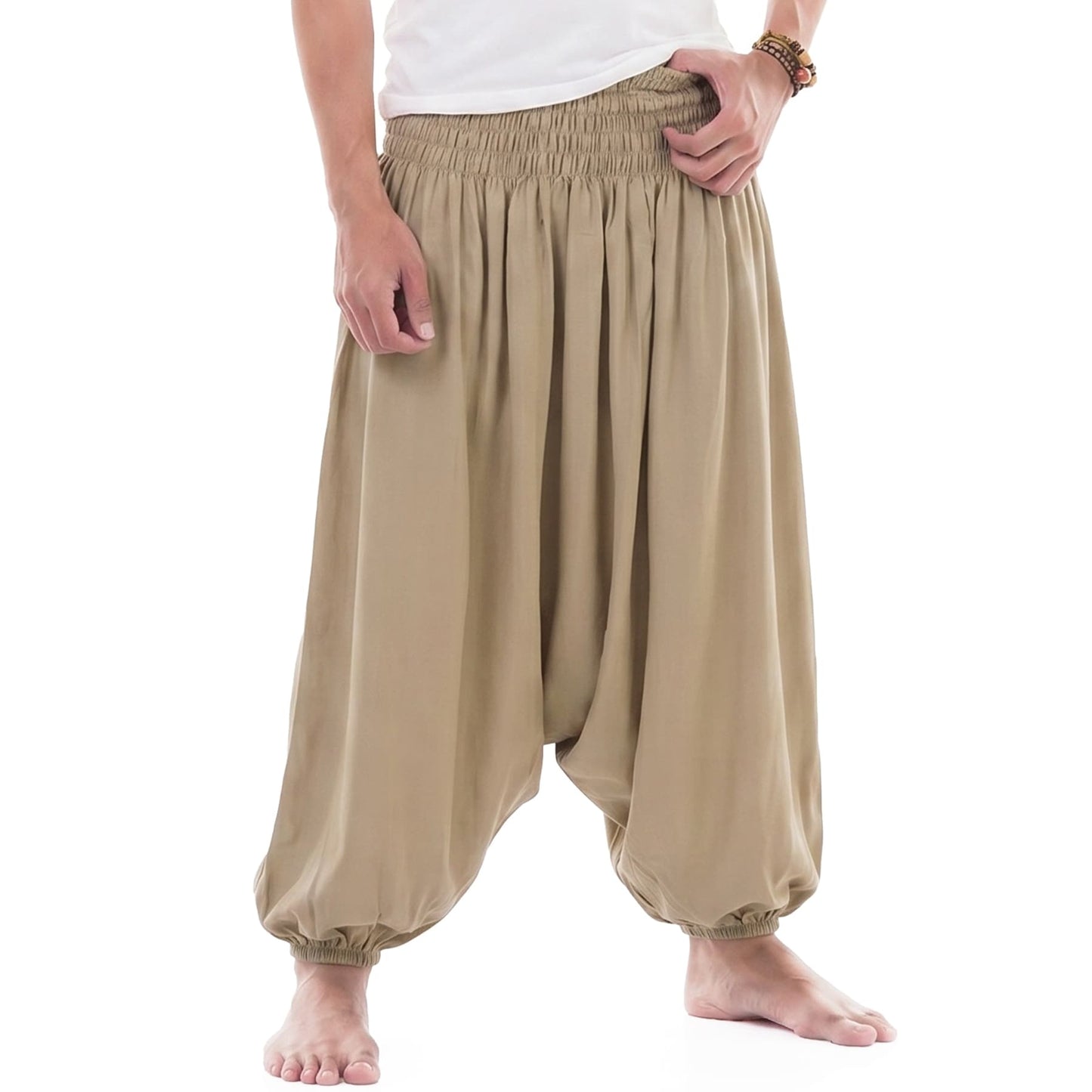 Close-up shot of the beige sand-colored Men's drop crotch harem pants, showcasing the smooth texture of the bamboo rayon.