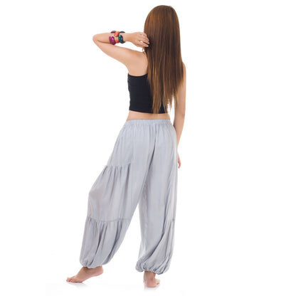 Back view of gray women Thai yoga harem pants worn with black shirt