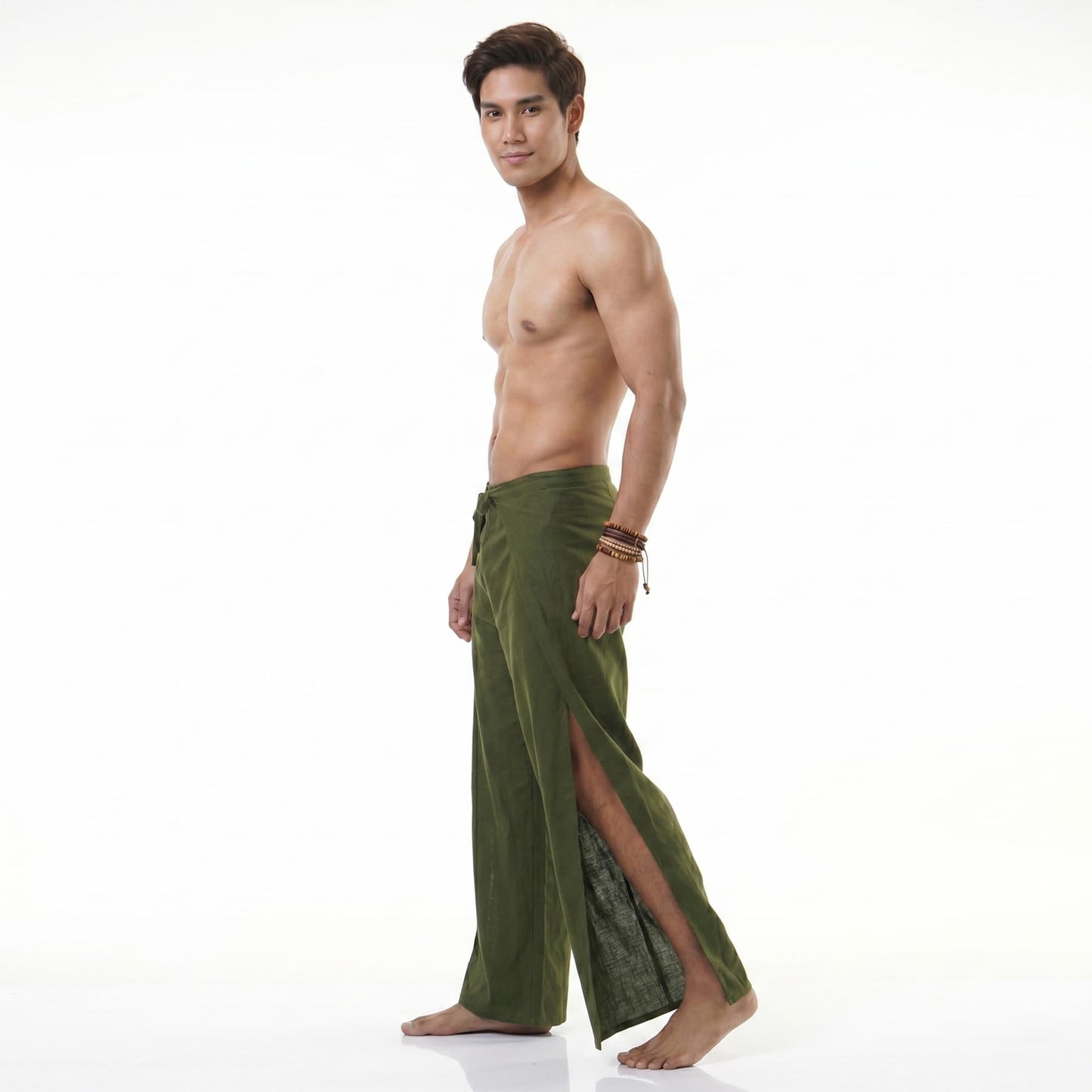 Side profile of the green Men's Thai wrap pants, showing the comfortable flowy style.