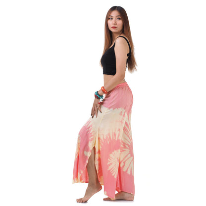 Side profile of the Radiant Red Hippie Tie Dye Palazzo Pants on a female model, demonstrating the lightweight drape and loose fit.