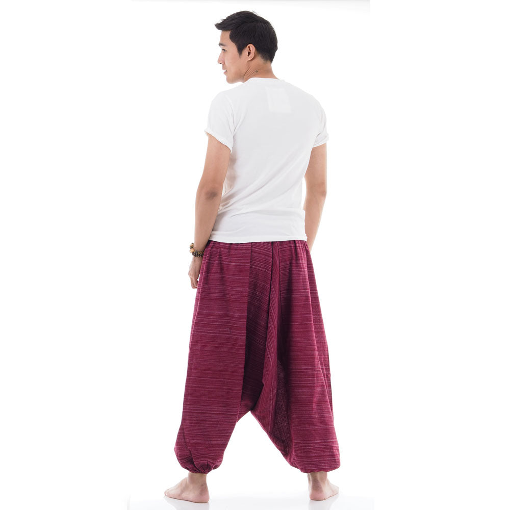 Back view of maroon men pinstripe drop crotch Thai harem pants worn with white shirt