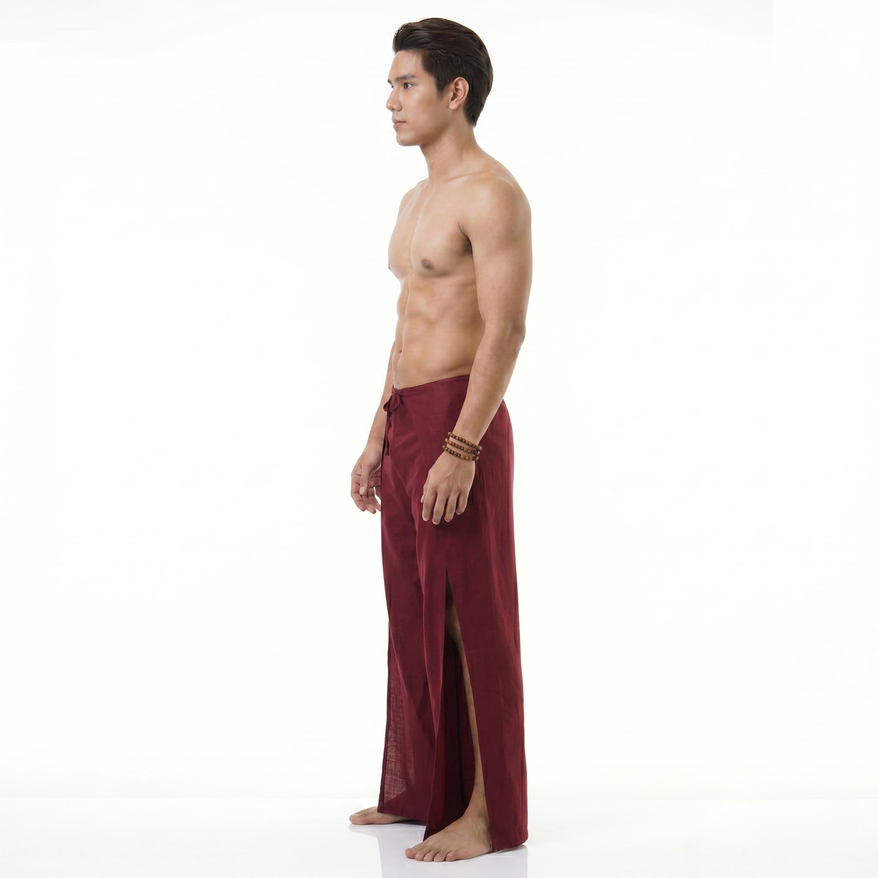 Side view of the maroon wrap pants for men, displaying the authentic folding silhouette.