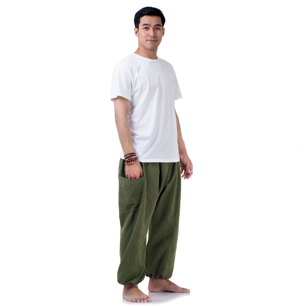 Side profile of the Jungle Green pants, featuring the elastic ankle cuffs and loose fit.