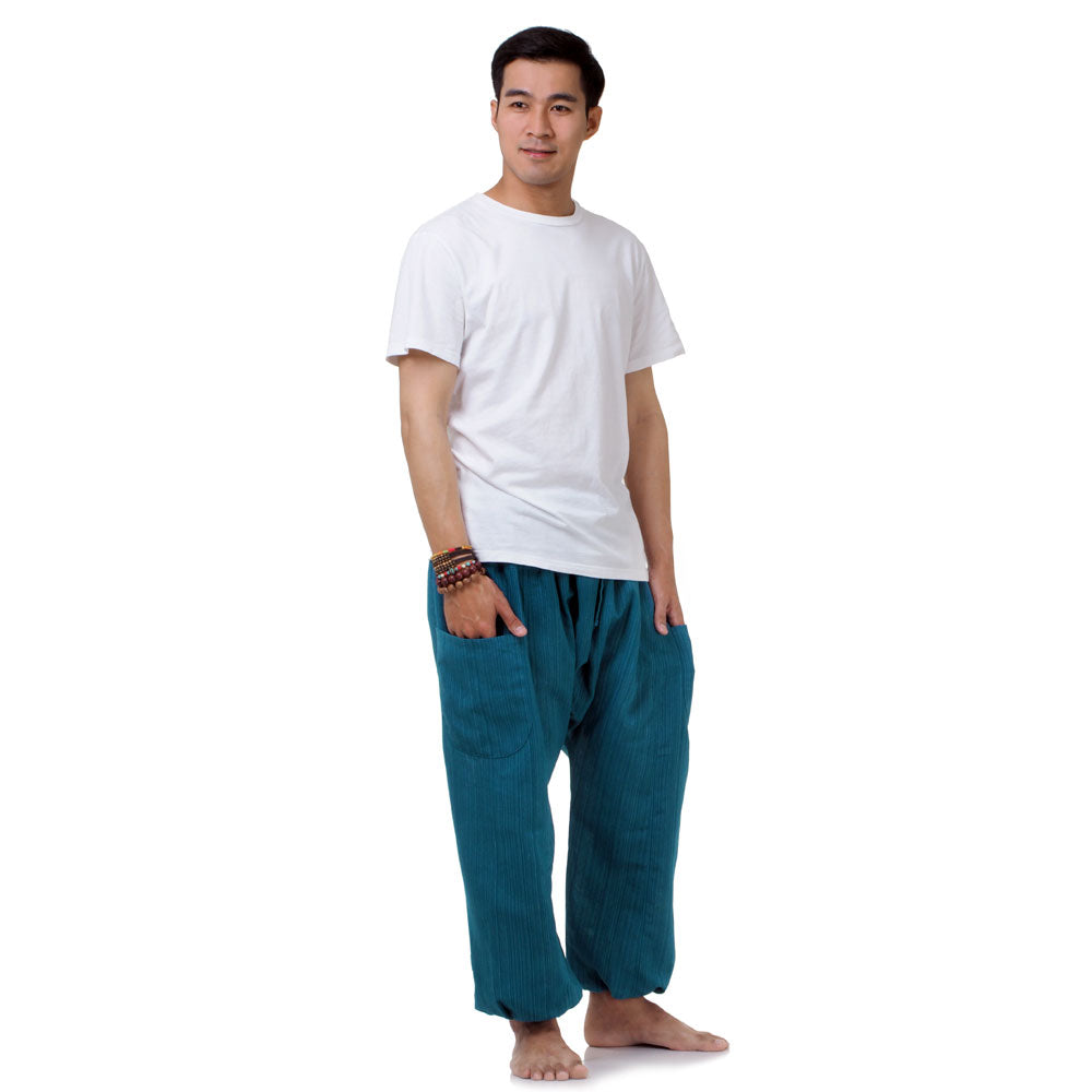Side profile of the Coastal Turquoise pants, illustrating the relaxed fit and handcrafted quality.