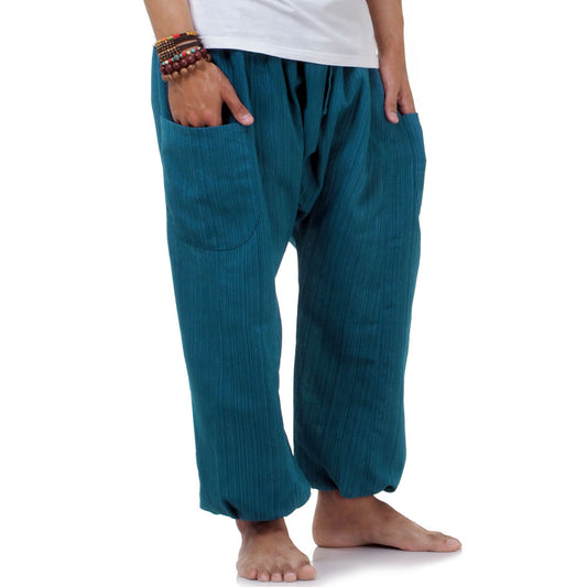 Macro detail of the Coastal Turquoise pinstripe cotton, inspired by the vibrant colors of Thailand.