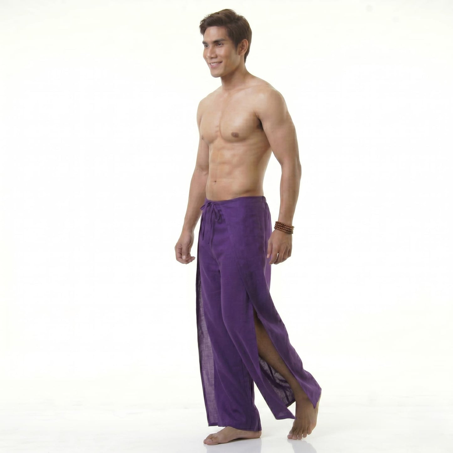 Side profile of the purple Men's Thai wrap pants, showcasing the loose wrap-around construction.
