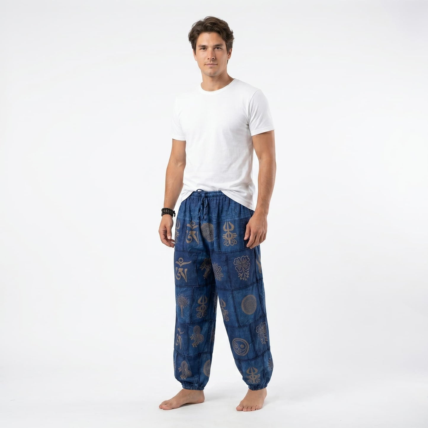 Side profile of the blue organic cotton tribal harem pants for men, showing the comfortable silhouette and elastic ankle cuffs.
