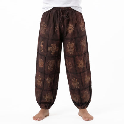 Close-up shot of the brown stonewashed organic cotton material, highlighting the handmade tribal pattern.