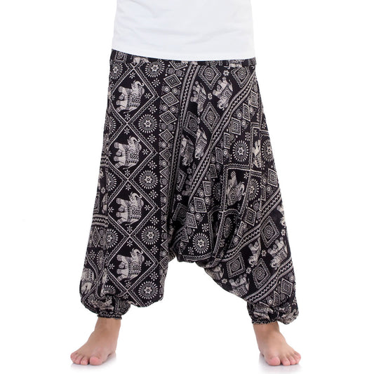 Close-up black drop crotch harem pants with traditional elephant print.
