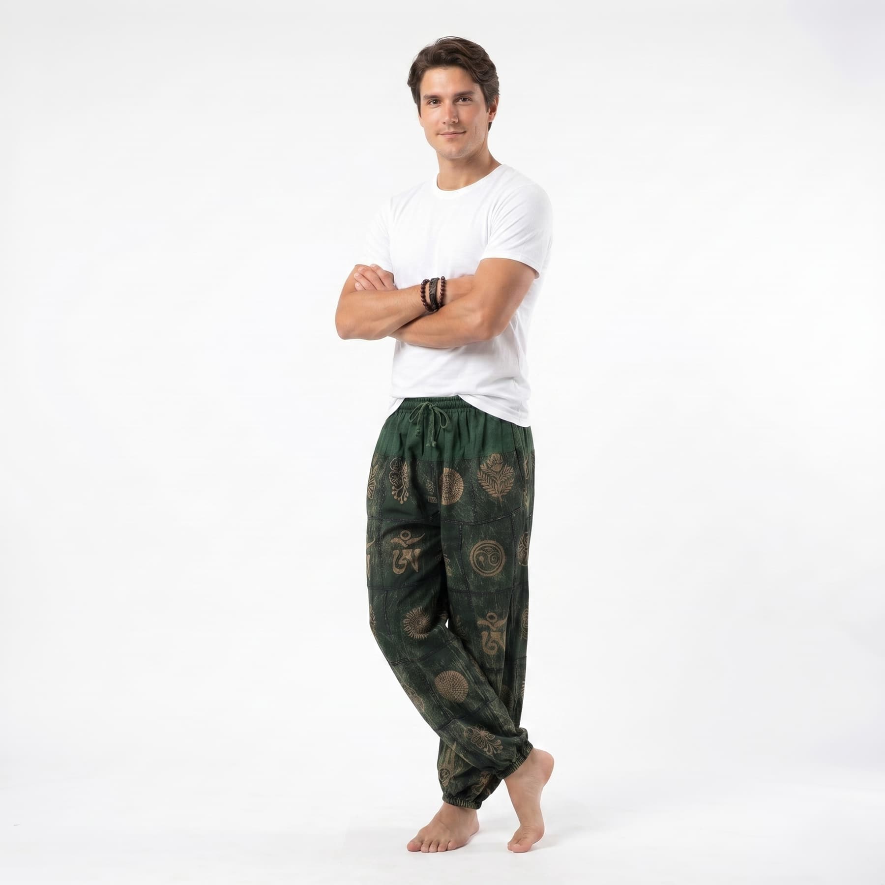 Side view of the green organic cotton harem pants for men, displaying the loose-fitting design and flexible waistband.