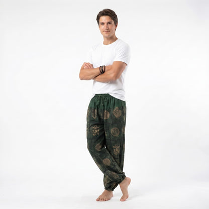 Side view of the green organic cotton harem pants for men, displaying the loose-fitting design and flexible waistband.