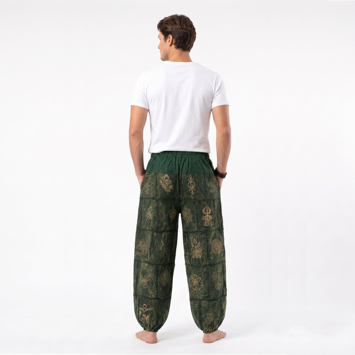 Back view of the green stonewashed organic cotton Men's harem pants, emphasizing the airy cut for warm days.