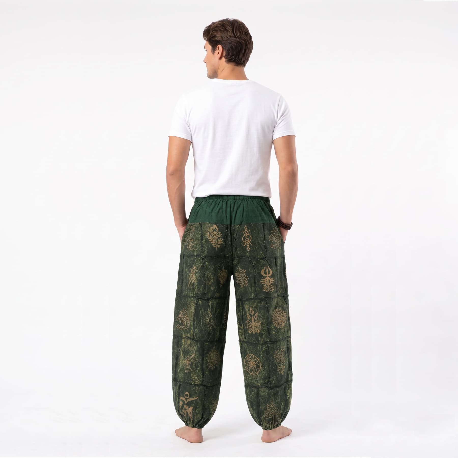 Back view of the green stonewashed organic cotton Men's harem pants, emphasizing the airy cut for warm days.