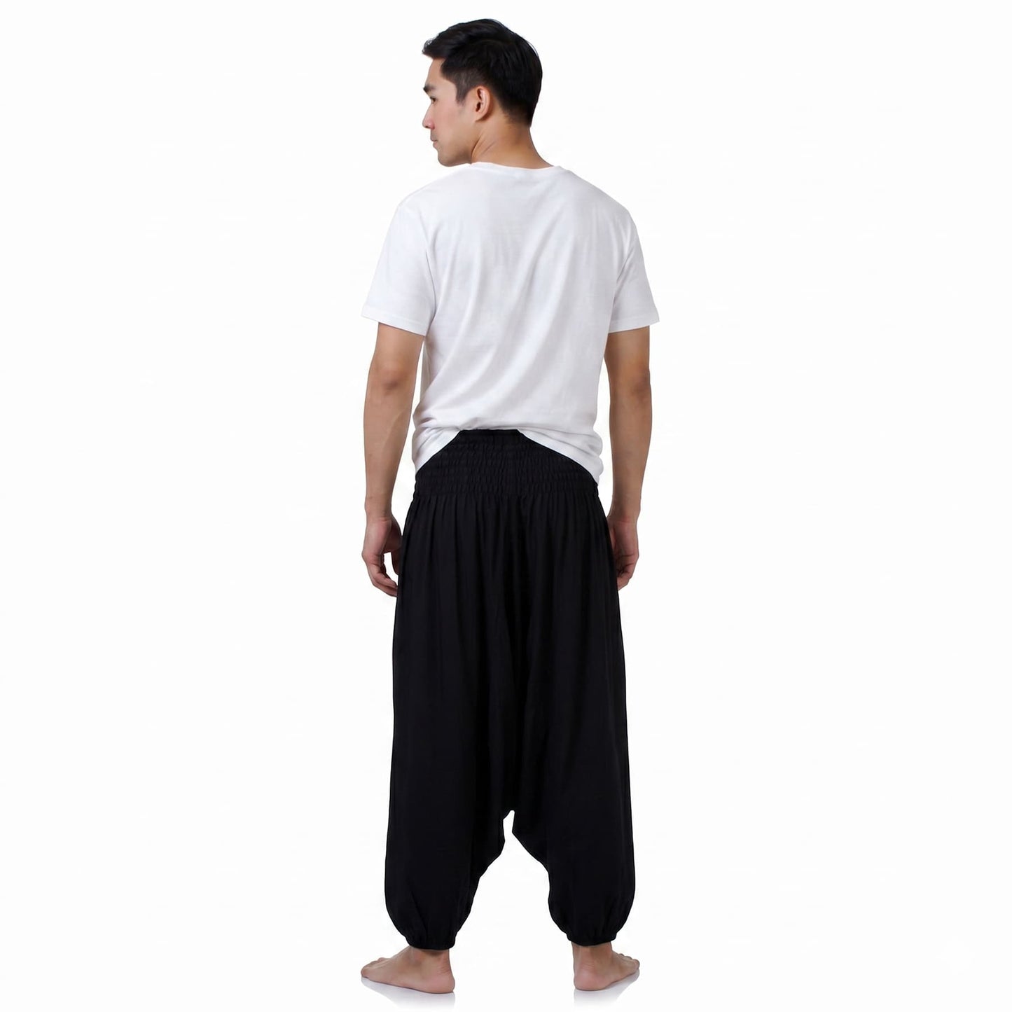 Rear view of the black Men's drop crotch harem pants, showcasing sustainable and relaxed festival fashion.