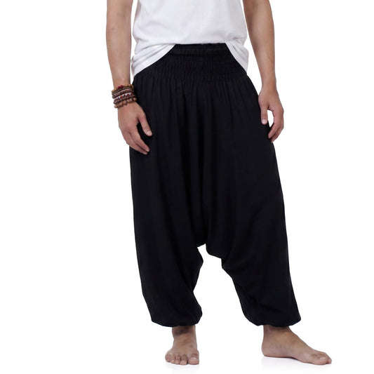 Detailed close-up of the classic black Men's drop crotch harem pants fabric, handmade from premium vegan rayon.
