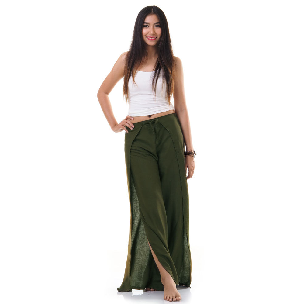 Model wearing green Thai wrap pants skirt with white top, front view