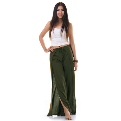 Model wearing green Thai wrap pants skirt with white top, front view