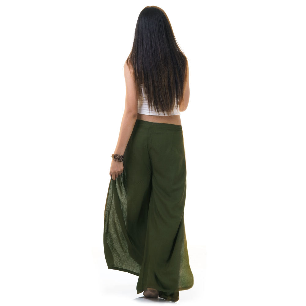 Back view of green Thai wrap pants skirt worn with white top