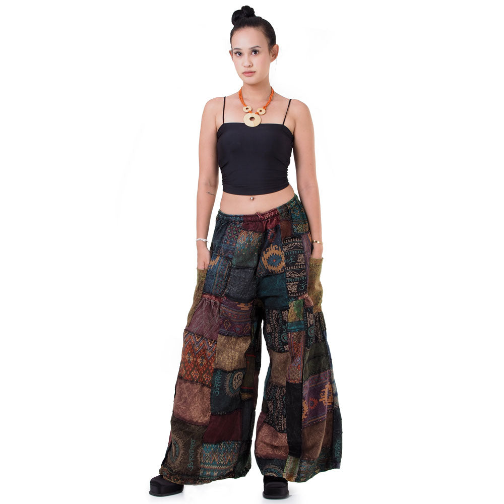 Frontal view of black boho patchwork wide-leg palazzo pants showing the hippie style.