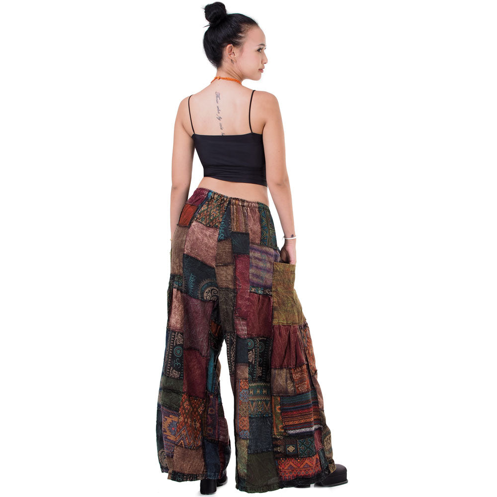 Rear view of black boho patchwork wide-leg palazzo pants showing the elastic waist.