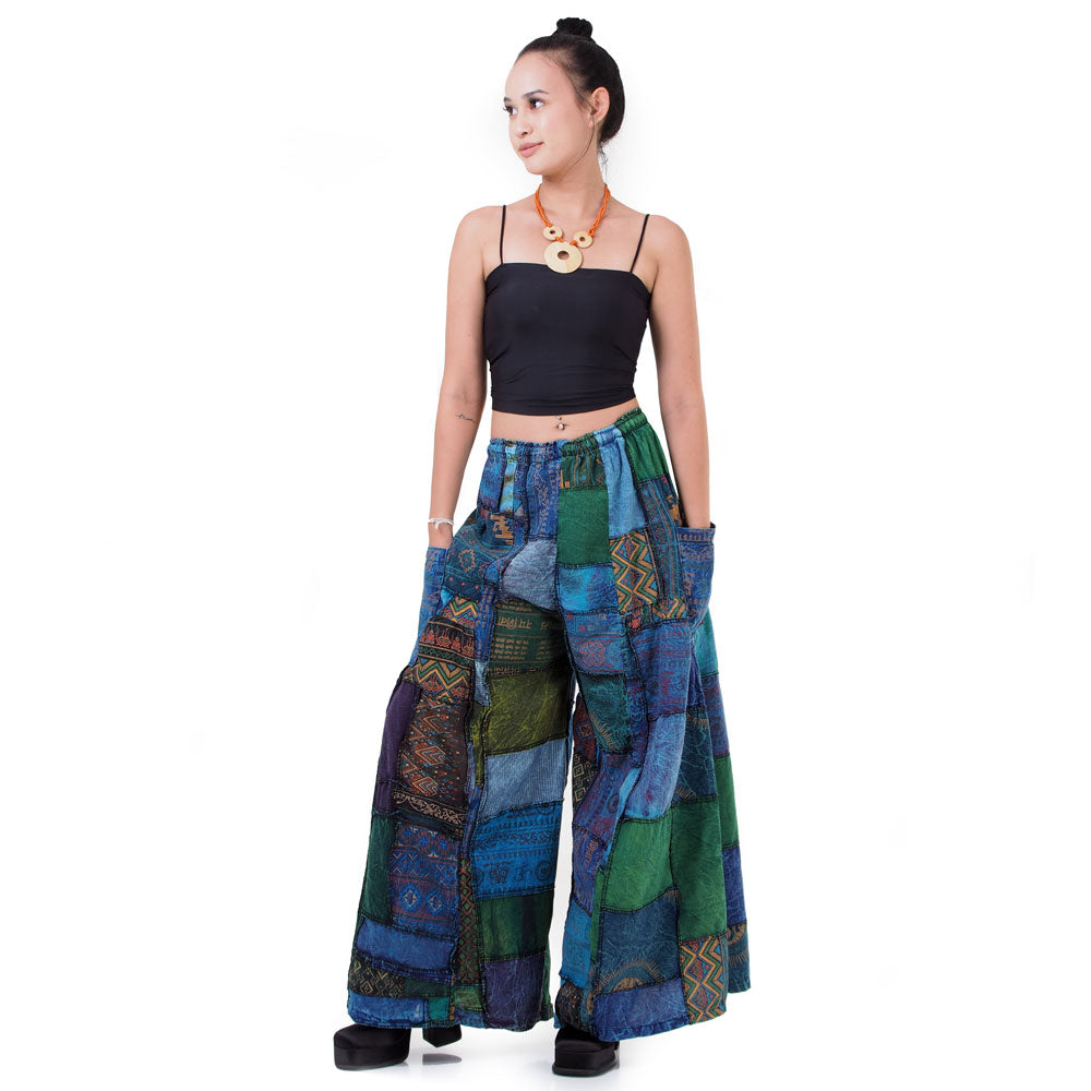 Studio front shot of blue boho wide-leg patchwork palazzo pants for a versatile unisex fit.