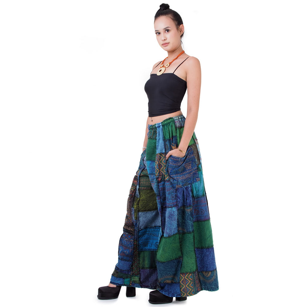 Side view of blue boho patchwork wide-leg palazzo pants showing the loose, flowy leg.