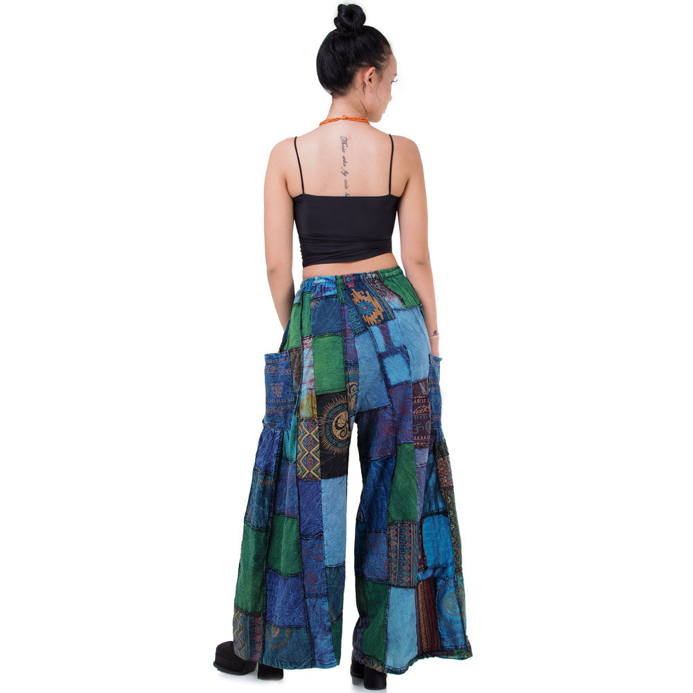 Rear view of blue boho patchwork wide-leg palazzo pants on a model.