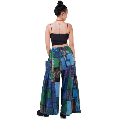 Rear view of blue boho patchwork wide-leg palazzo pants on a model.