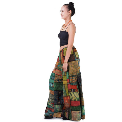 Side view of brown wide-leg boho patchwork palazzo pants showing the flowy silhouette and side pockets.