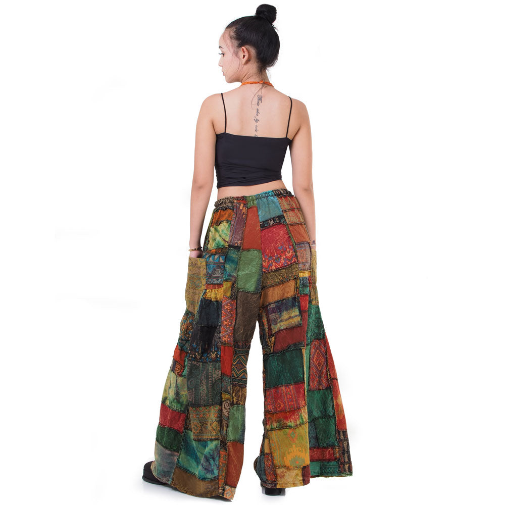 Back view of brown boho patchwork wide-leg palazzo pants highlighting the elastic waistband.
